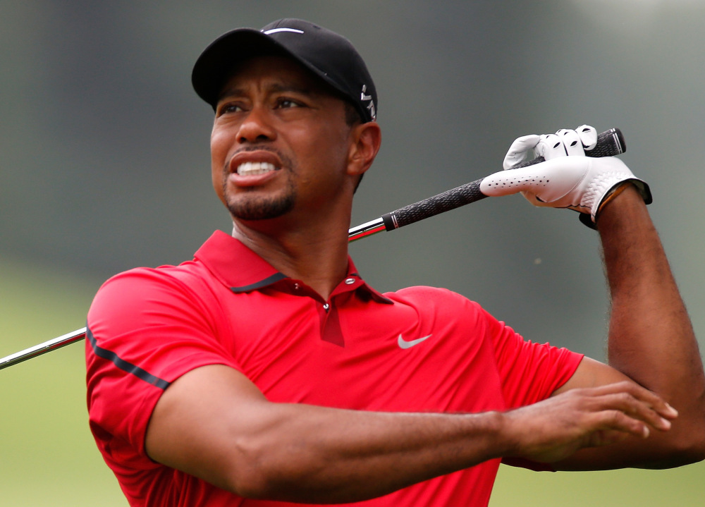 AKRON, OH - AUGUST 03: Tiger Woods hits off the third fairway during the final round of the World Golf Championships-Bridgestone Invitational at Firestone Country Club South Course on August 3, 2014 in Akron, Ohio. (Photo by Gregory Shamus/Getty Images)