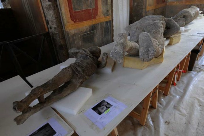 A picture shows petrified victims of the eruption of Vesuvius volcano in 79 BC, during the restoration work and the study of 86 casts in the laboratory of Pompeii Archaeological Site, on May 20, 2015 in Pompeii. AFP PHOTO / MARIO LAPORTA (Photo credit should read MARIO LAPORTA/AFP/Getty Images)